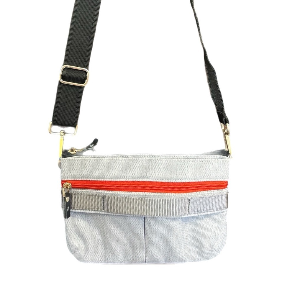 Grey tactical purse w/ red zippers & multiple pockets